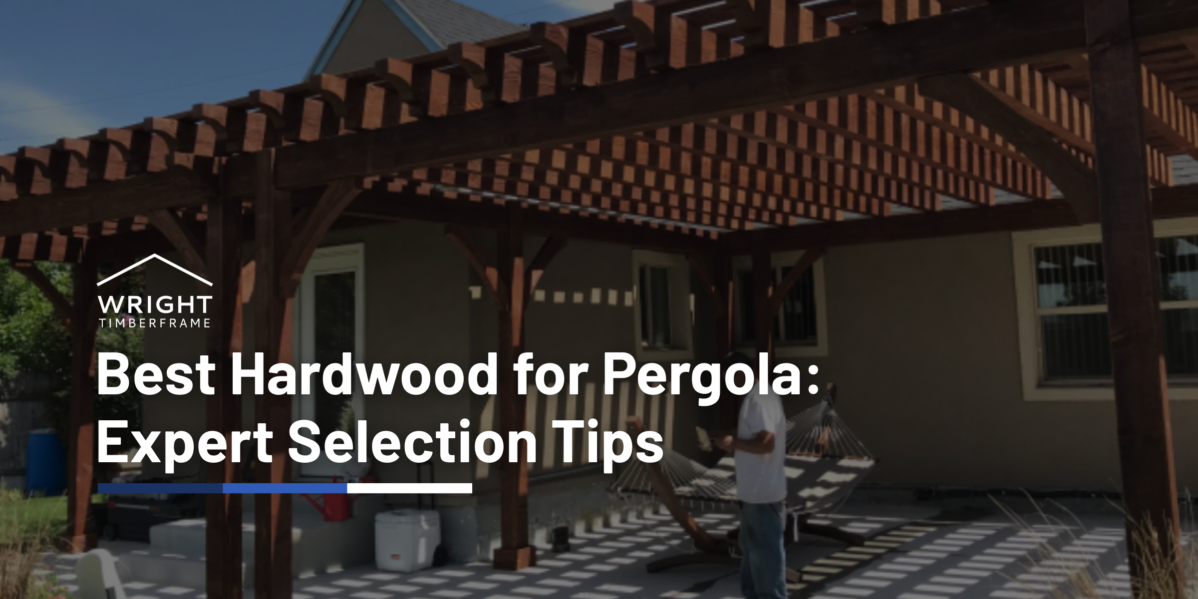 Pergola built with dark hardwood beams beside a home, illustrating the best hardwood for pergola durability, shade, and outdoor performance.