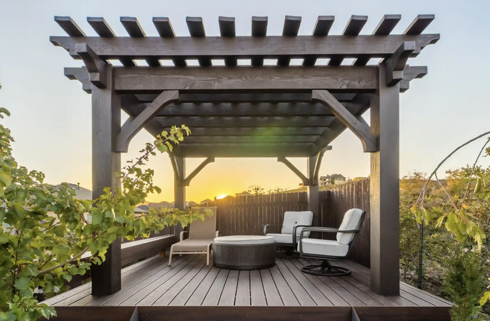 Backyard pergola-style structure at sunset highlighting Covered Pavilion vs Open Pergola differences in shade and design